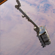 The Canadarm2 robotic arm shortly before releasing the pallet.